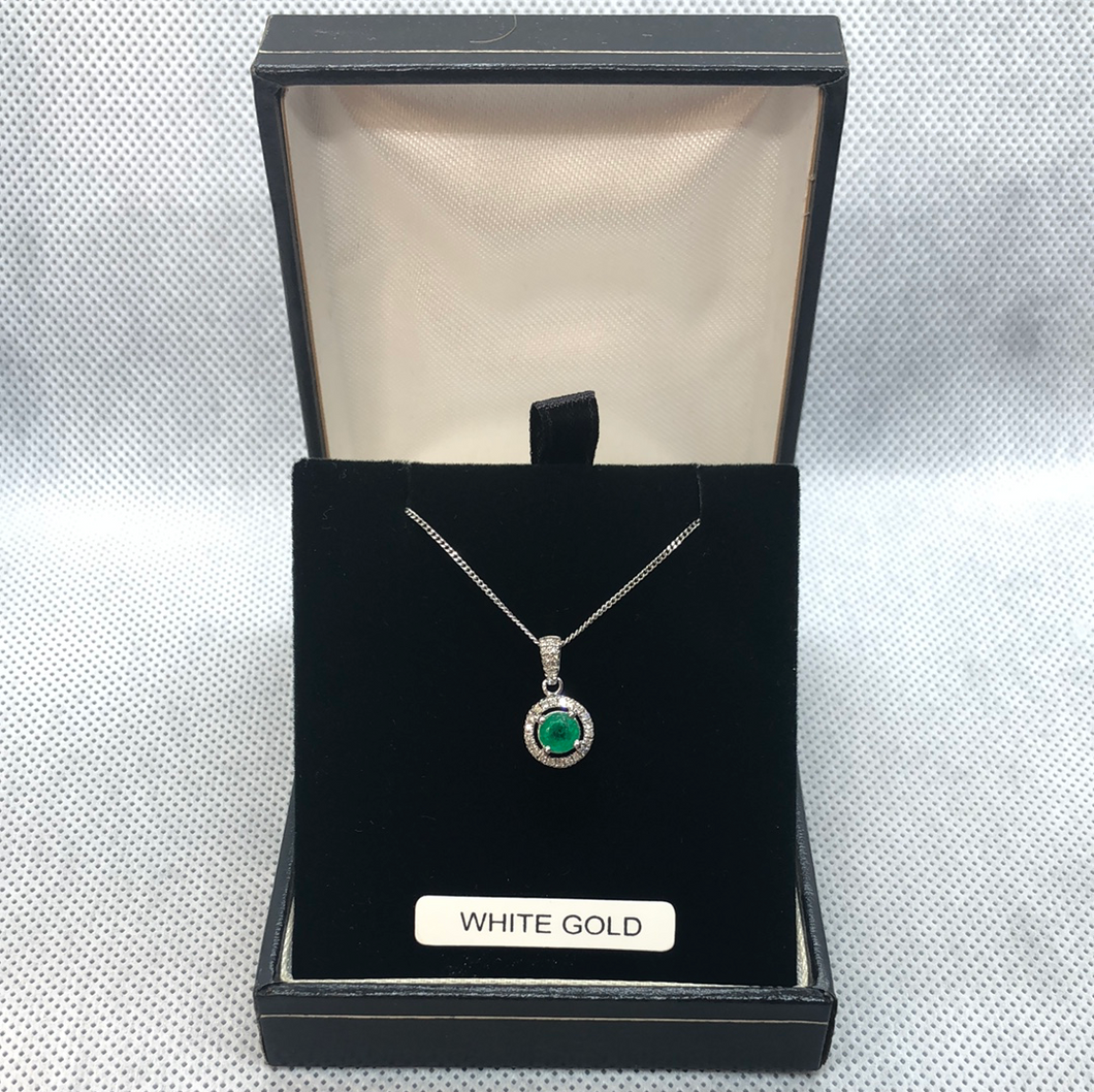 White gold emerald and diamond pendant and chain