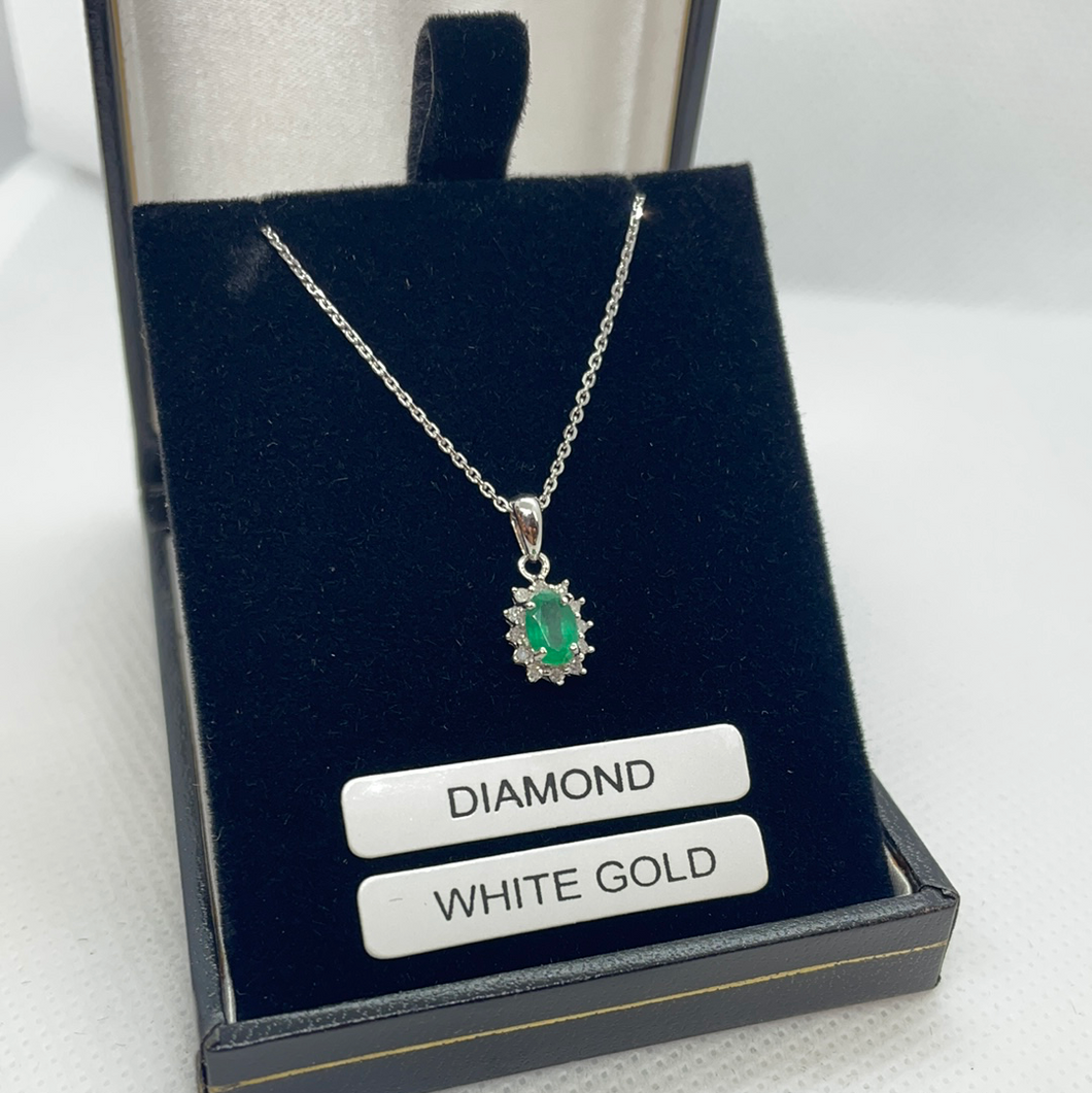 Emerald, diamond and white gold pendant and 18 inch chain