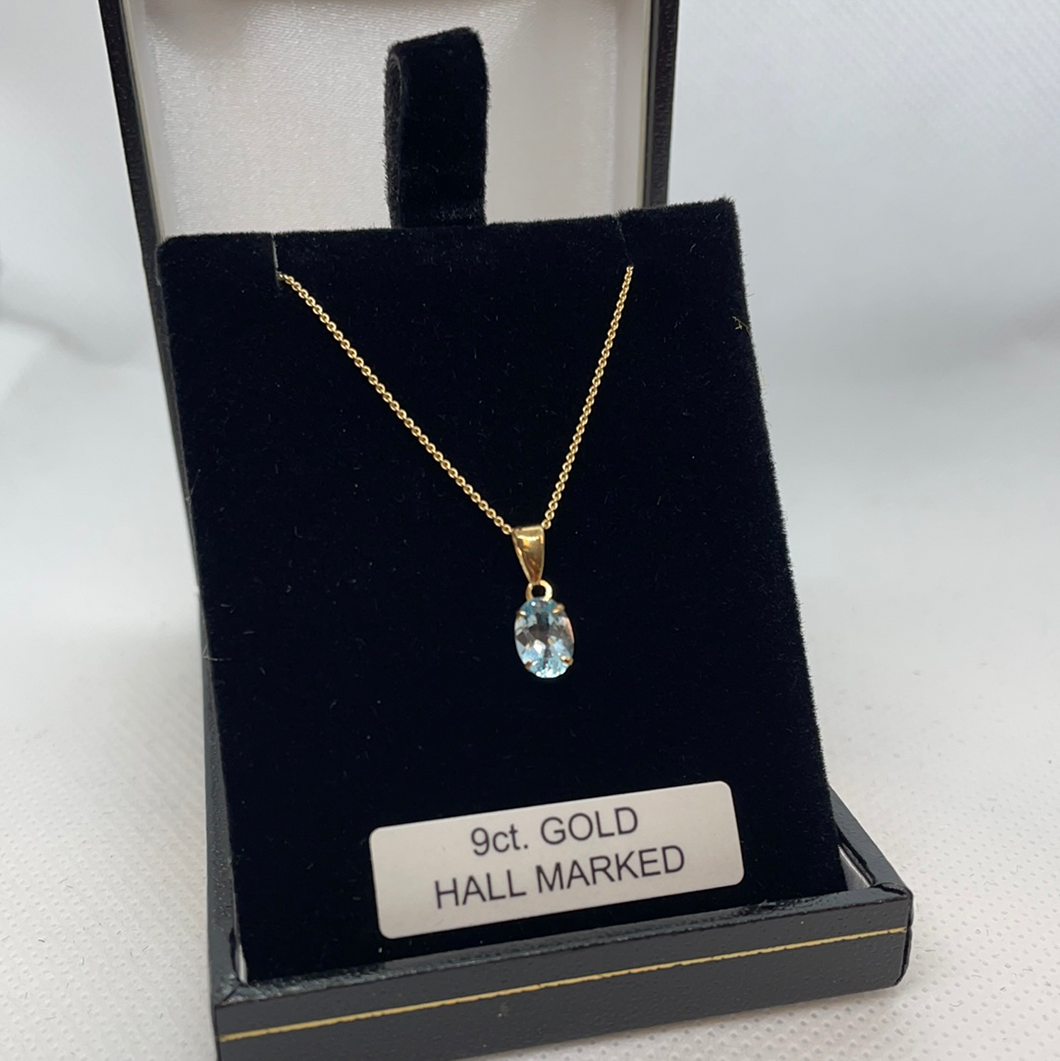 9ct Gold 18 inch chain and blue topaz pendant